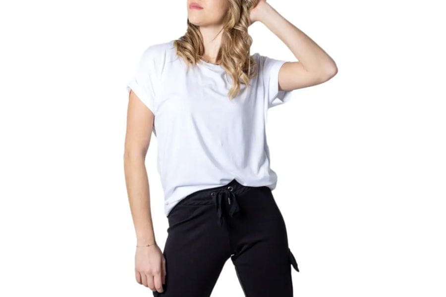 White cotton short sleeve t-shirt paired with black pants in Trendy Summer T-Shirt Collection.