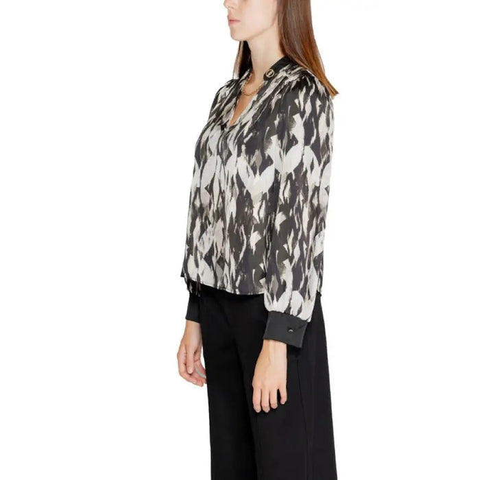 Abstract patterned Rinascimento women’s blouse with black and white print and dark cuffs