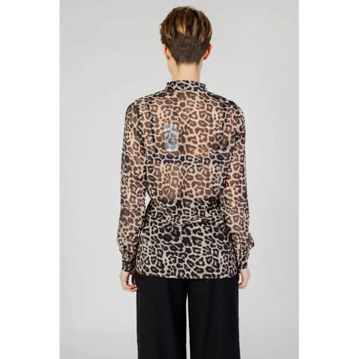 Guess Guess women wearing stylish animal print shirt from Guess Women Shirt collection