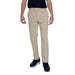 Beige chino pants with dark top and navy sneakers from Tommy Hilfiger Jeans Men Trousers