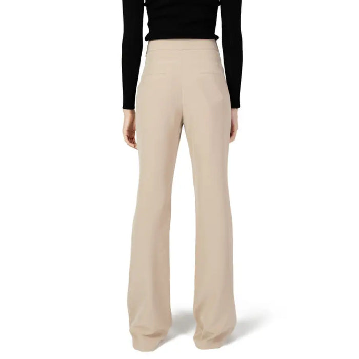 Beige high-waisted wide-leg trousers styled with a black top from Silence Women Trousers