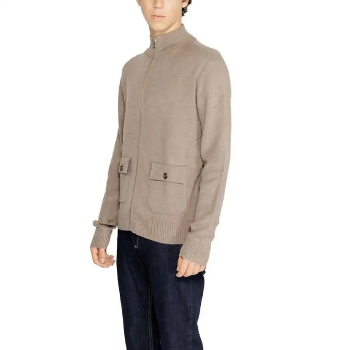 Beige knit sweater with high collar and front pockets from Hamaki-ho Men Knitwear