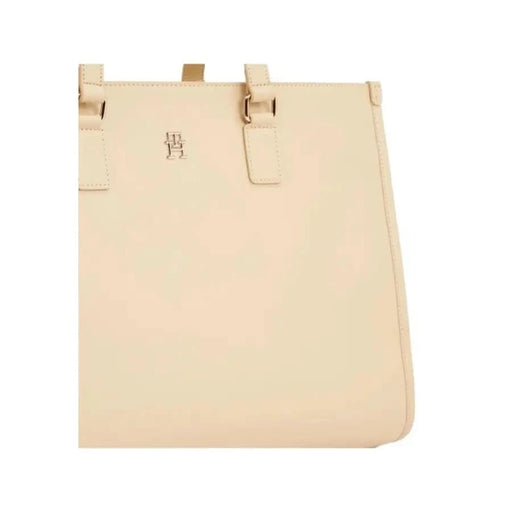 Beige leather tote bag with minimalist design by Tommy Hilfiger for women