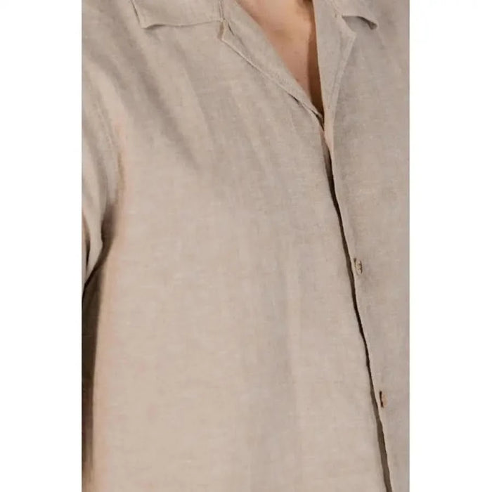 Beige linen button-up shirt with collar from Hamaki-ho Men’s Collection