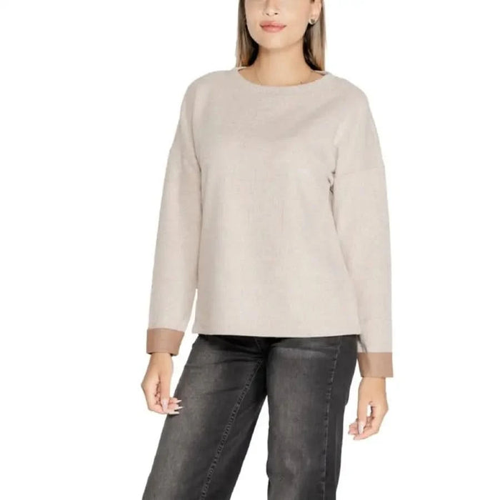 Beige long-sleeved sweater on a woman from Street One Women’s Knitwear collection