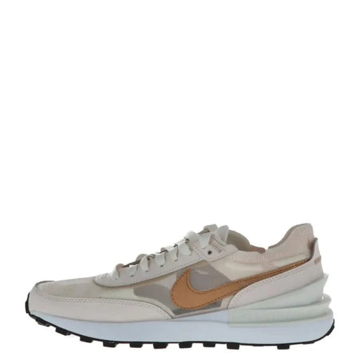 Beige and tan low-top Nike Women Sneakers with a white sole