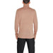 Beige turtleneck sweater on a person viewed from behind in Calvin Klein Men Knitwear