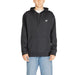 New Balance hoodie sweatshirt in black worn over a white t-shirt from New Balance Men Sweatshirts