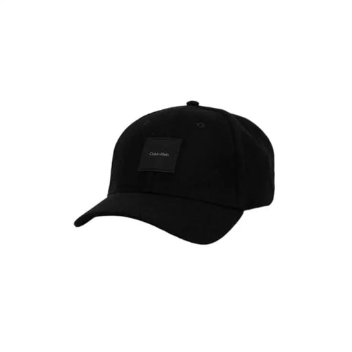 Black Calvin Klein men’s baseball cap featuring a small dark label patch on the front