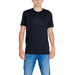 Black Calvin Klein t-shirt with embossed logo worn by person in blue jeans