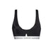 Black Calvin Klein sports bra featuring a white logo band for women beachwear