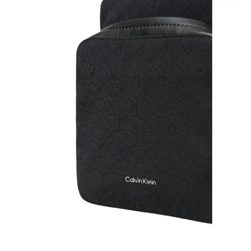 Black Calvin Klein Cross Body Bag featuring textured monogram pattern for men