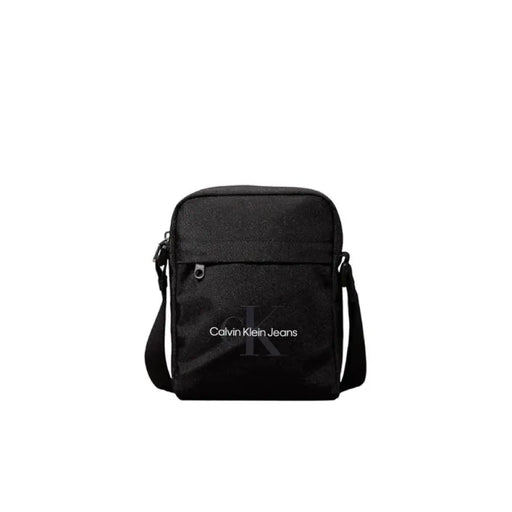 Black Calvin Klein Jeans messenger bag with shoulder strap and front pockets