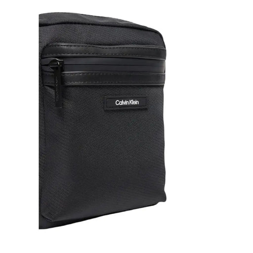 Black Calvin Klein crossbody bag featuring multiple zippered compartments for men