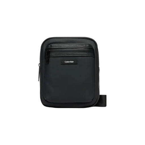 Black Calvin Klein crossbody bag featuring multiple zippered compartments for men