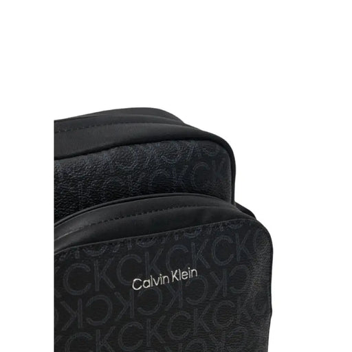 Black Calvin Klein shoulder bag for men featuring monogram logo pattern