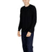 Black crewneck sweater worn by a model from Armani Exchange Men Knitwear collection