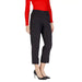 Black cropped dress pants with cuffed hems styled with a red top and black heels