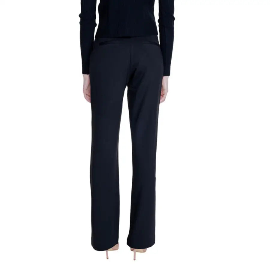 Guess Women Trousers - Black dress pants worn stylishly by a person