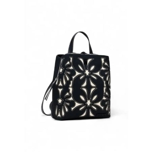 Black handbag by Desigual features floral cutout pattern and metallic accents