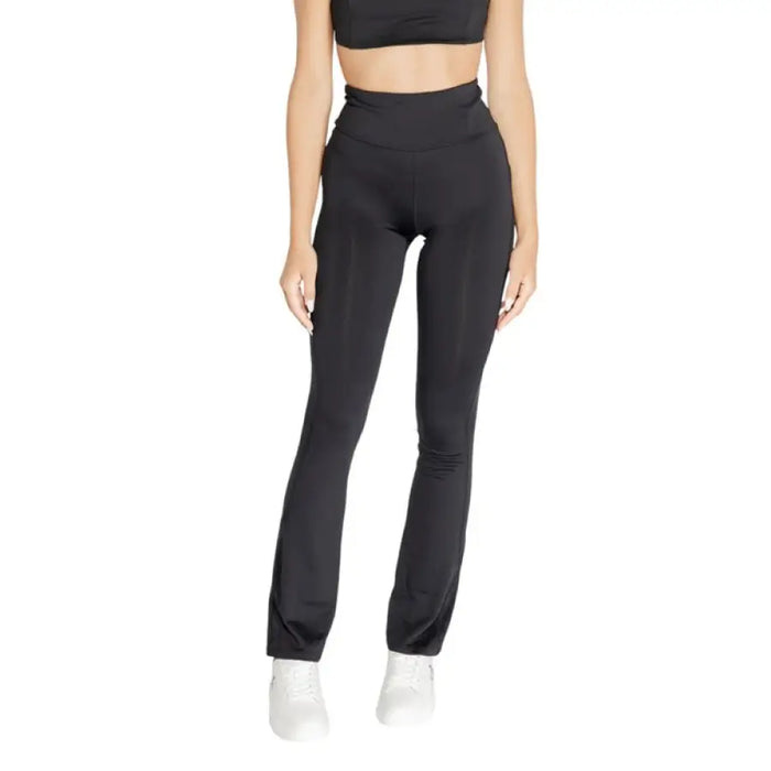 Black high-waisted flared yoga pants by Calvin Klein Sport for women’s activewear