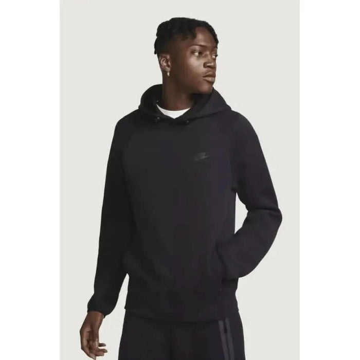 Nike Men Sweatshirts - Black hooded sweatshirt modeled against a plain background