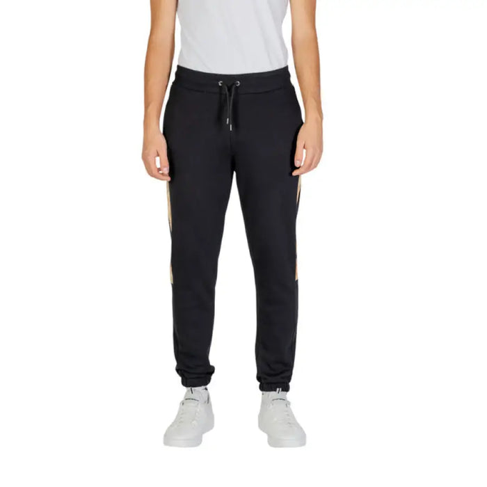 Black jogger sweatpants with elastic cuffs and drawstring waist by Alviero Martini