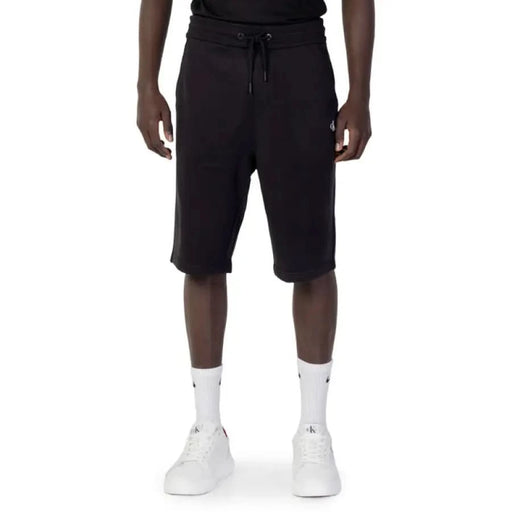 Calvin Klein Jeans Men’s knee-length black athletic shorts with drawstring waistband