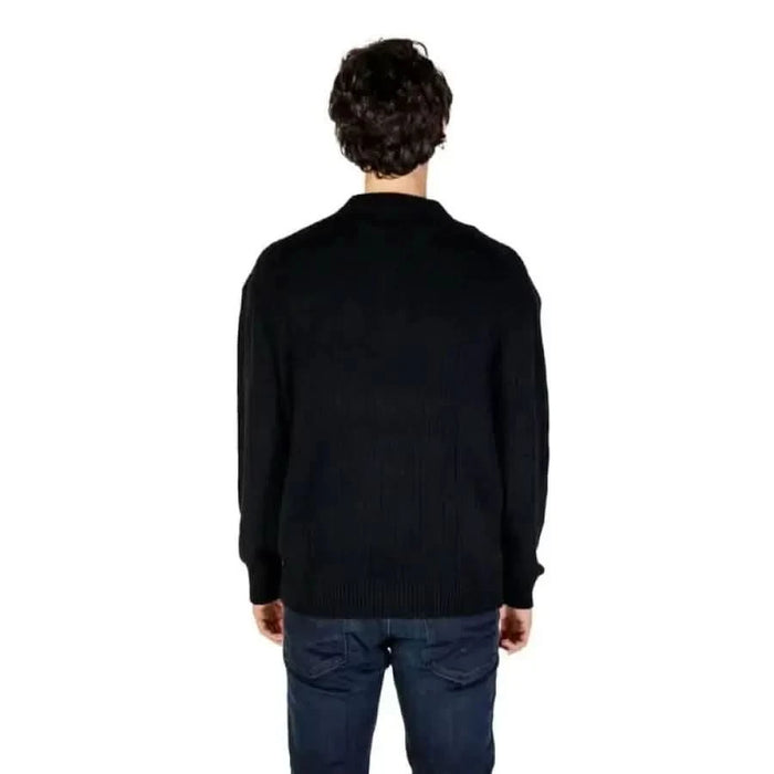 Black knit sweater and blue jeans from behind, Calvin Klein Jeans Men Knitwear