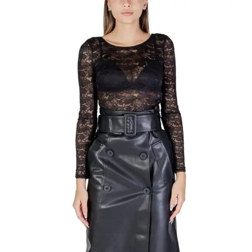 Black lace bodysuit with long sleeves and leather belted skirt by Morgan De Toi