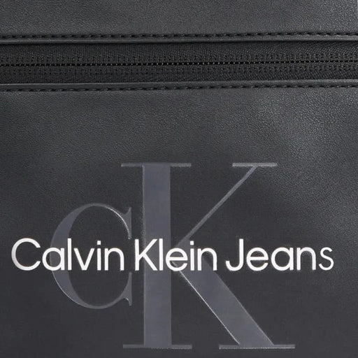 Black leather Calvin Klein Men Bag accessory featuring a zipper and branded logo