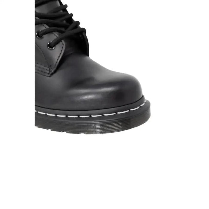 Dr. Martens Women Boots - Black leather boot with white stitching along the sole