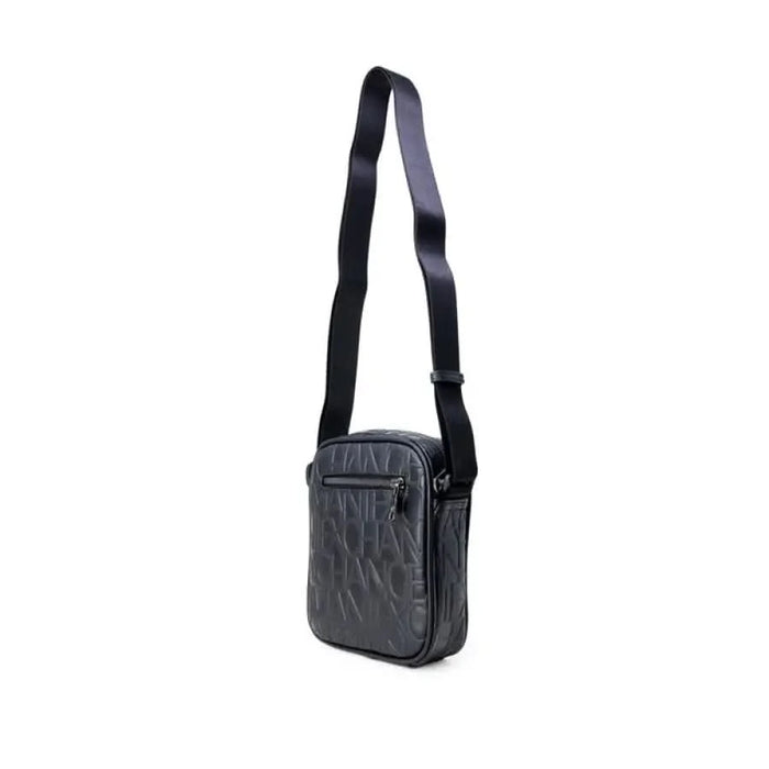 Black leather crossbody bag with textured surface and adjustable strap by Armani Exchange