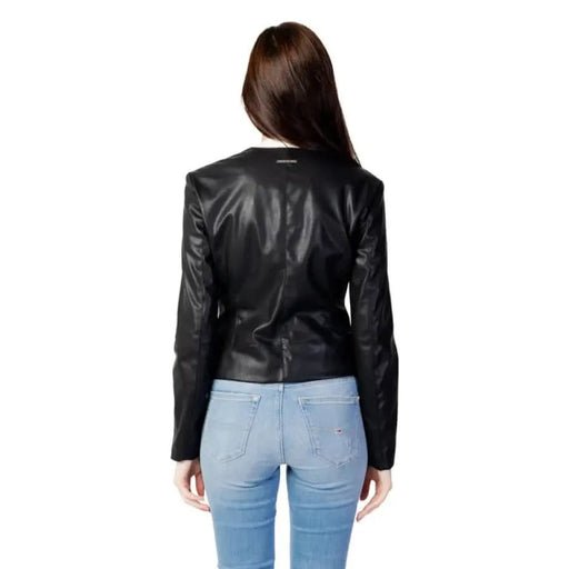 Armani Exchange black leather jacket with light blue jeans, back view, women’s blazer