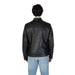 Black leather jacket with zip and front pockets paired with light blue jeans