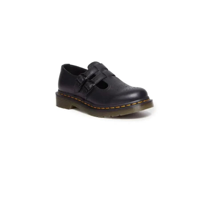 Black leather Dr. Martens Mary Jane shoe with chunky sole and yellow stitching