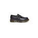 Black leather Dr. Martens women’s shoe with double buckle straps and chunky sole