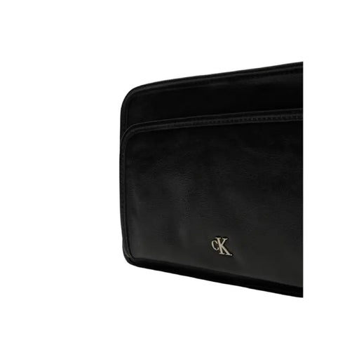 Black leather wallet clutch featuring CK logo emblem from Calvin Klein Women Bag