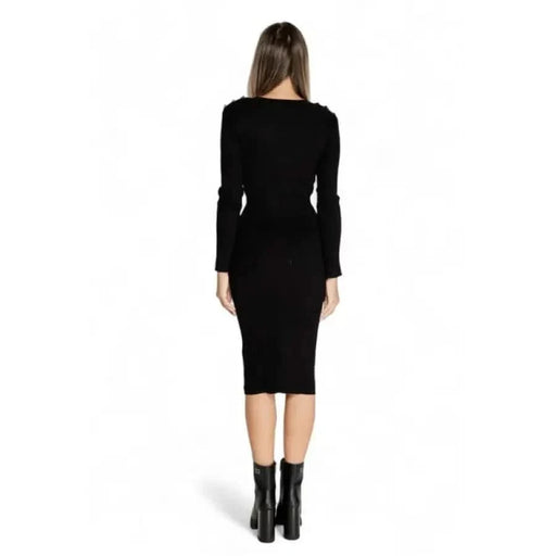 Black long-sleeved bodycon midi dress showcased by a woman in Morgan De Toi collection