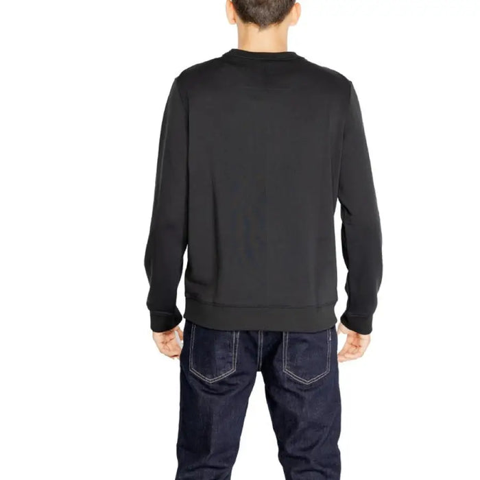 Black long-sleeved crewneck sweater on model from behind, Calvin Klein Sport Men Sweatshirts