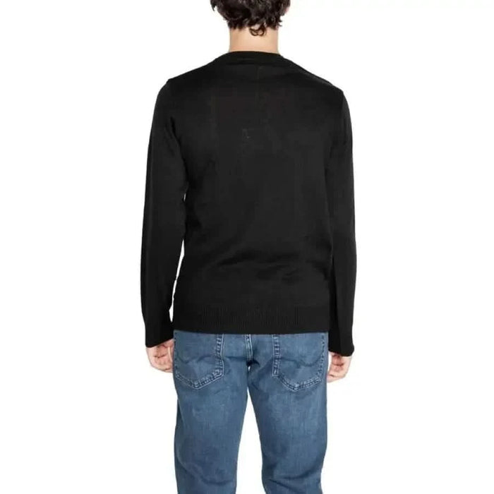 Black long-sleeved sweater displayed from the back in Icon Men Knitwear collection