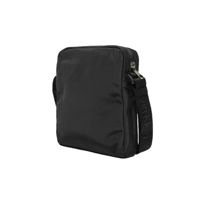 Black messenger bag with shoulder strap from Calvin Klein in durable polyester