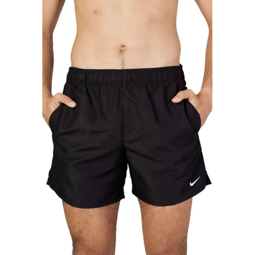 Black Nike athletic shorts featuring side pockets and an elastic waistband for comfort