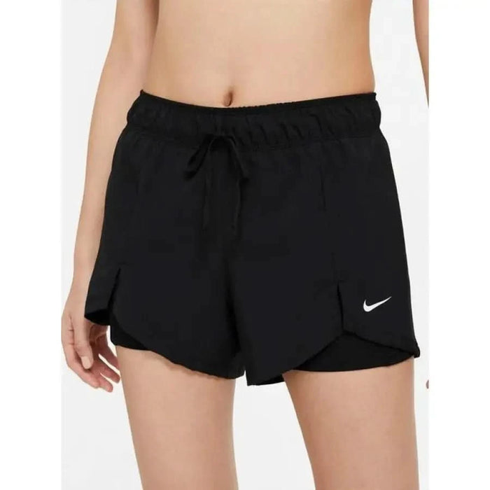 Black Nike athletic shorts with drawstring waist and side slits for women