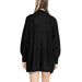 Black oversized knit cardigan with long sleeves worn by a person from behind