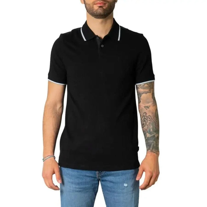 Black polo shirt with white collar trim from Armani Exchange Men Polo collection