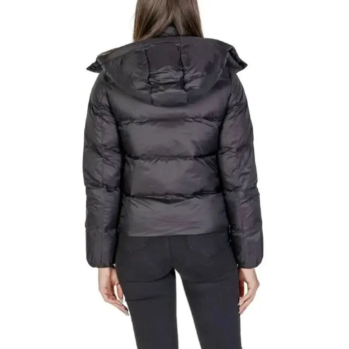 Black puffy winter jacket with hood from the back by Calvin Klein Jeans for women