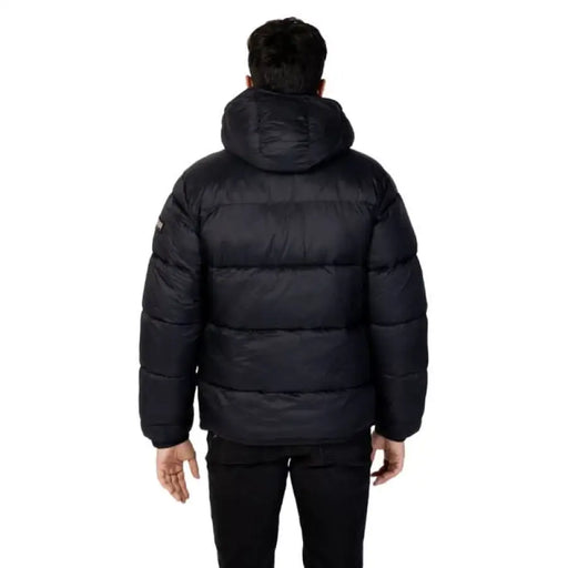 Black puffy winter jacket with hood viewed from the back by Napapijri