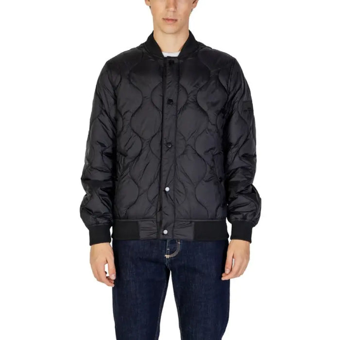 Black quilted bomber jacket with ribbed collar and snap buttons by Gianni Lupo