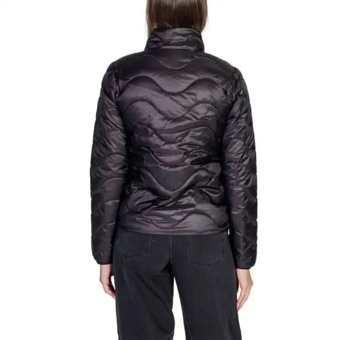 Black quilted puffer jacket from the back featured in Only Women Jacket collection